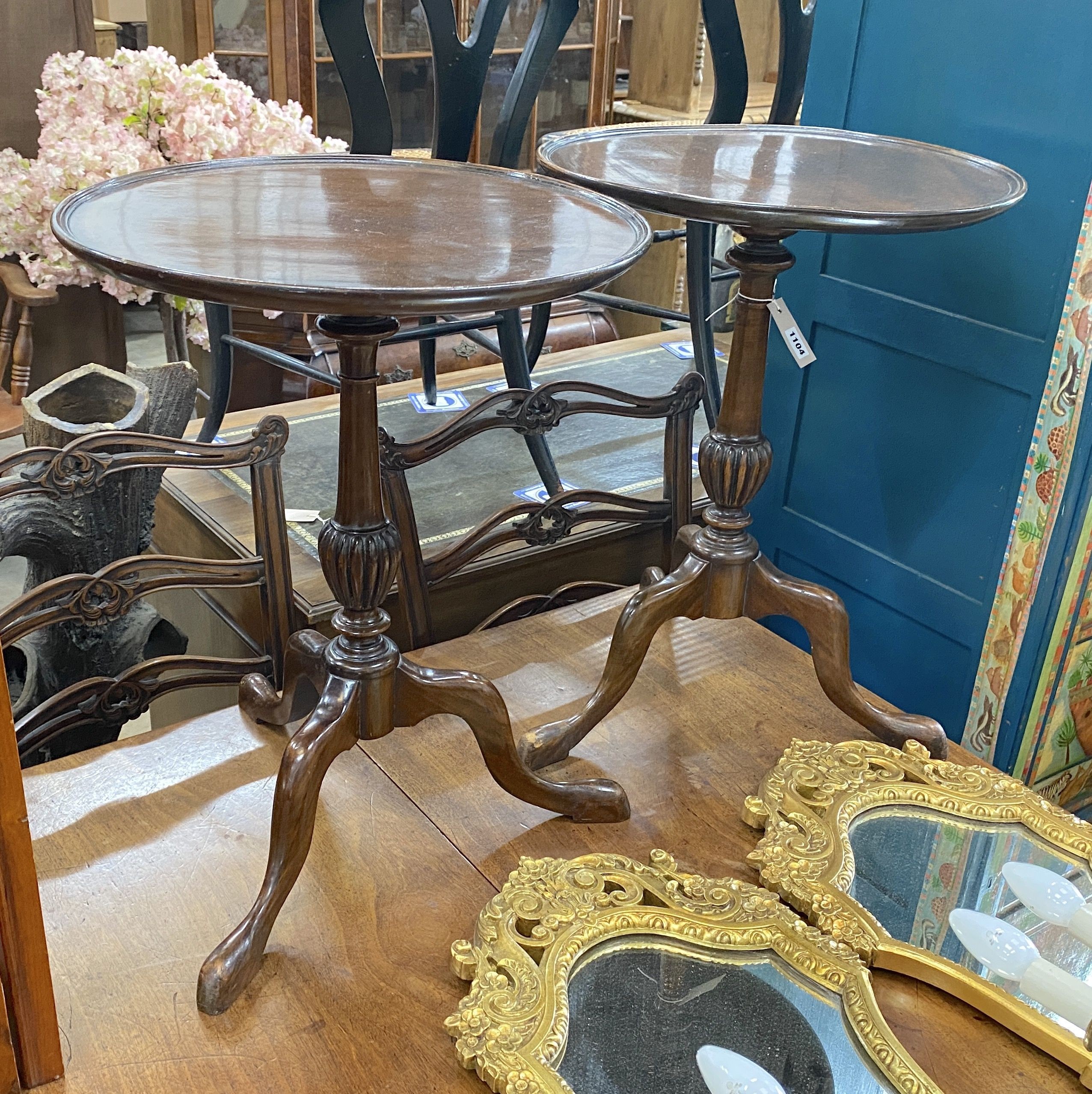 A pair of George III style circular mahogany tripod wine tables, diameter 45cm, height 59cm